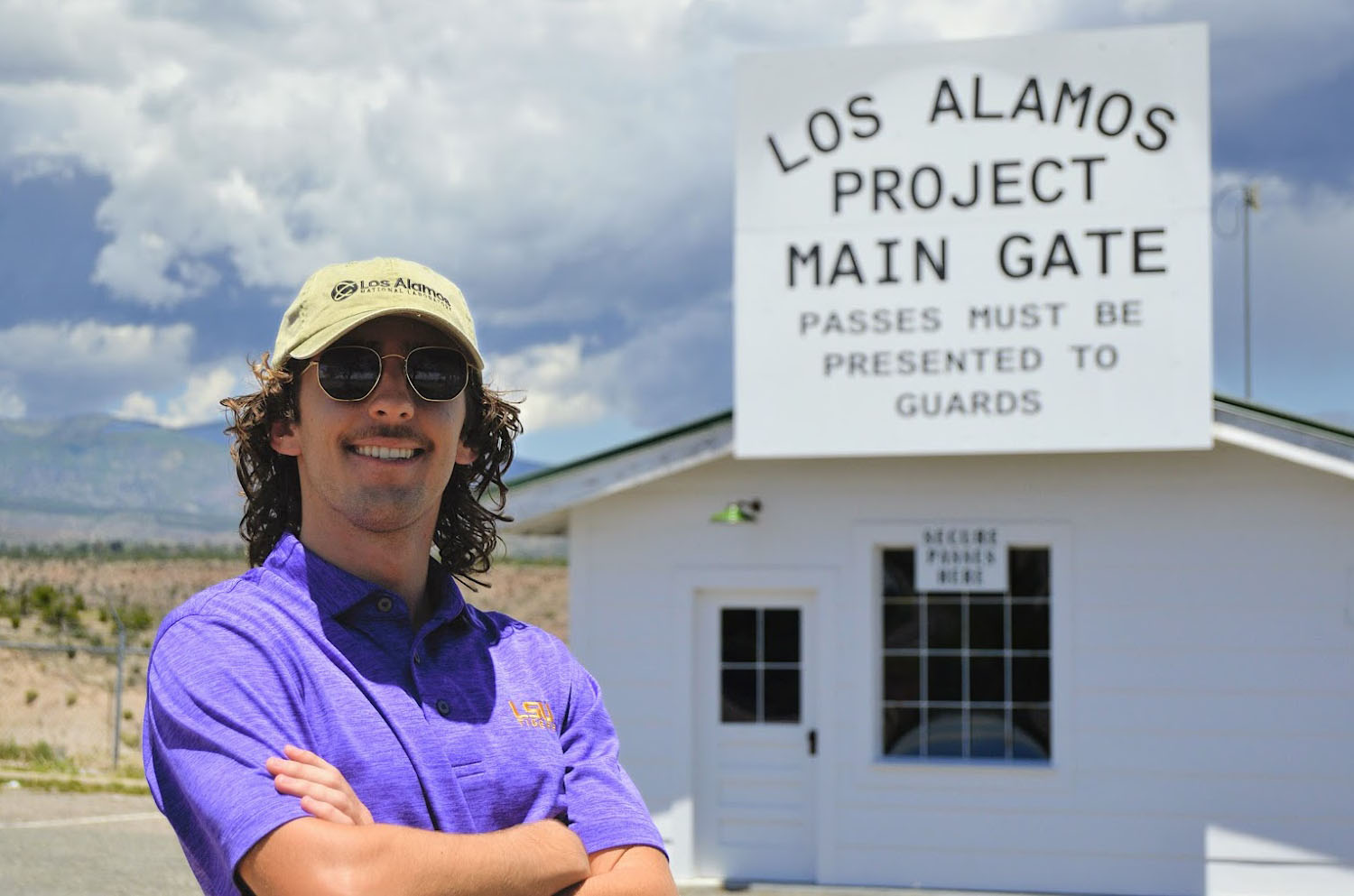 Reagan Courville visits a re-creation of the historic security gate all Manhattan Project workers passed through to enter Los Alamos.