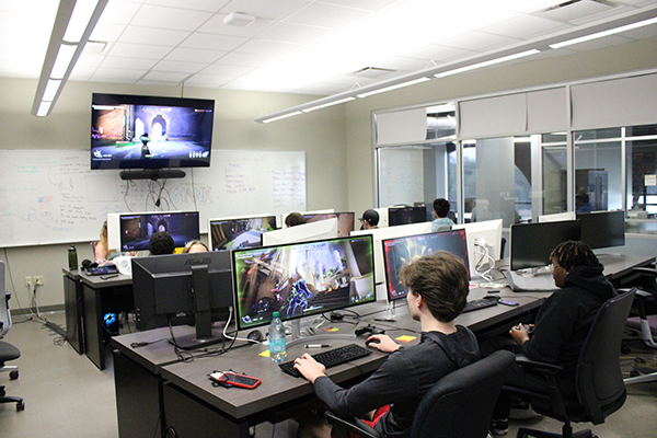 Students competing in a video game at the Esports camp