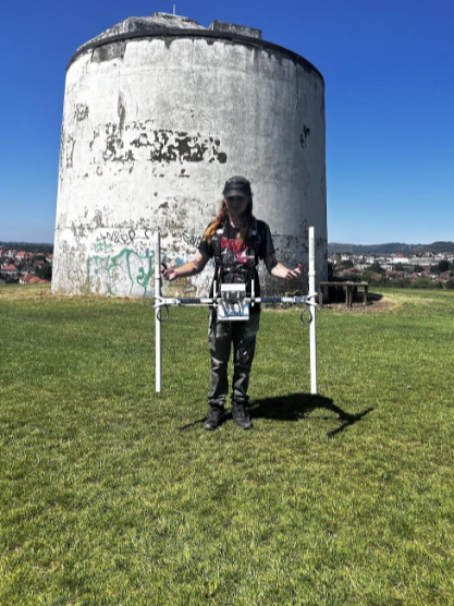 LSU student Cam Crooks completing a magnetometry survey of the area where a Bronze age burrow was located before the Napoleonic Martello tower was built. East Wear Bay Field School, Folkestone, Kent UK. 