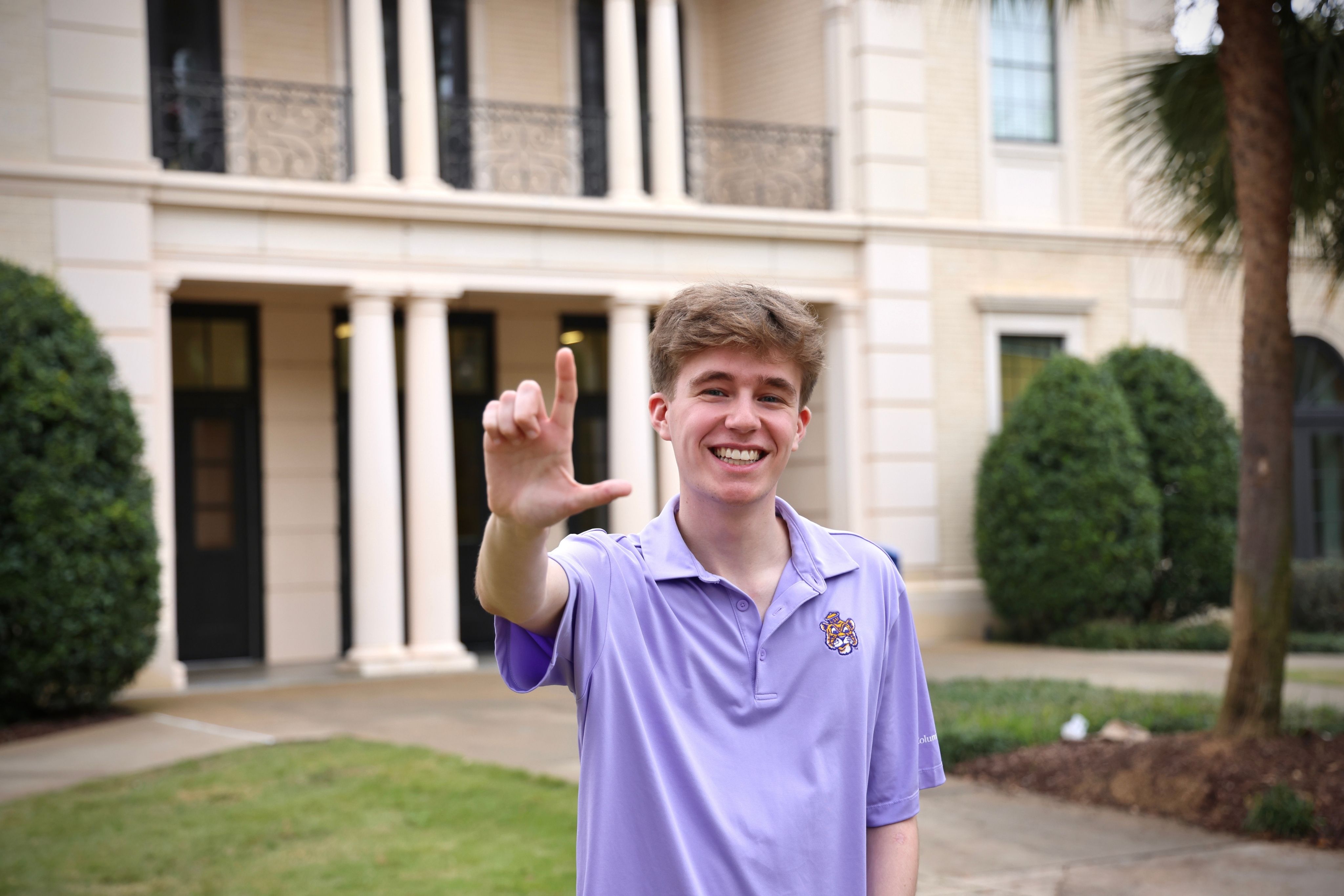 Alceide “AJ” Bergeron IV infront of the Laville Honors House