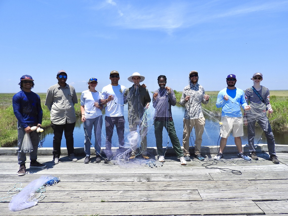 Group of students posing for a photo on a field trip