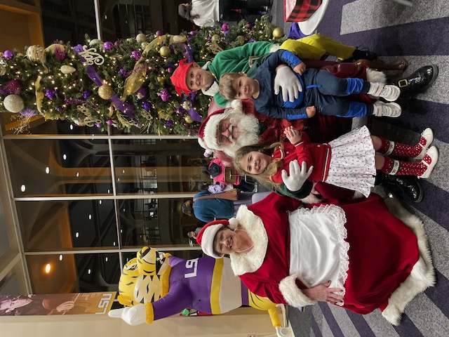 Santa Claus and Mrs. Claus with children